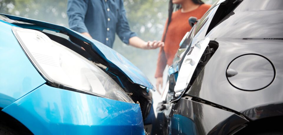 Two Angry Motorists Arguing Over Responsibility For Car Accident