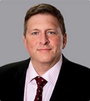 A professional headshot of attorney Matthew Moore smiling.