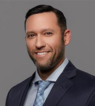 A professional headshot of attorney Theodore Berman smiling.